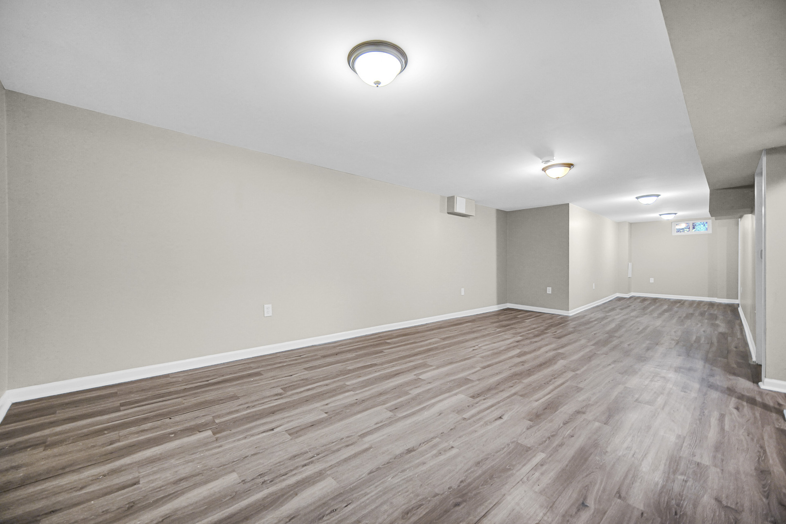 18144 Aberdeen Street Homewood, IL 60430 - Photo 19 of 25 an empty room with wooden floor and windows