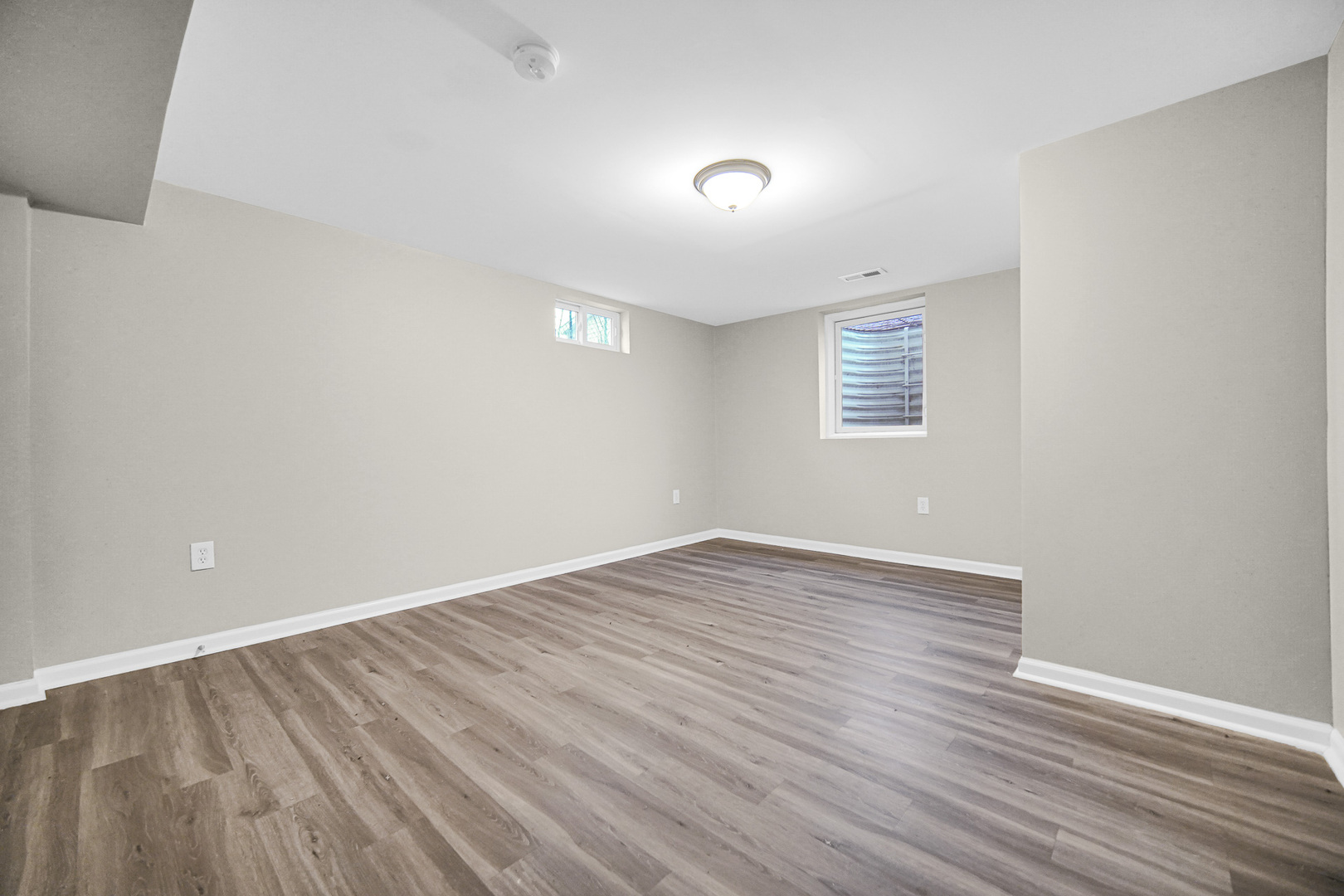 18144 Aberdeen Street Homewood, IL 60430 - Photo 21 of 25 a view of an empty room with wooden floor and a window