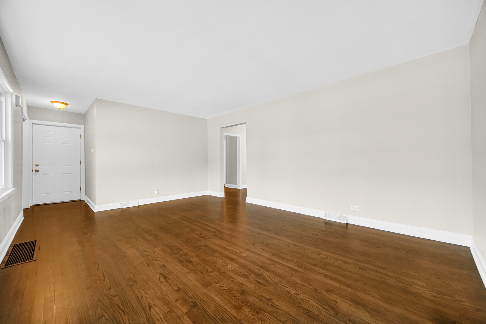 18144 Aberdeen Street Homewood, IL 60430 - Photo 6 of 25 a view of an empty room and wooden floor