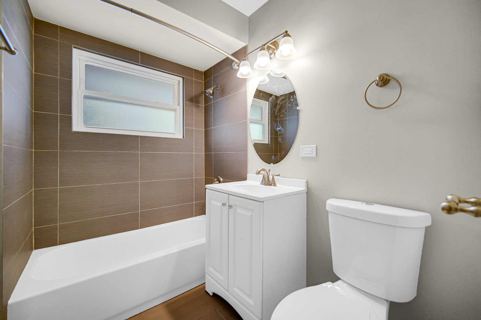18144 Aberdeen Street Homewood, IL 60430 - Photo 9 of 25 a bathroom with a toilet sink and mirror