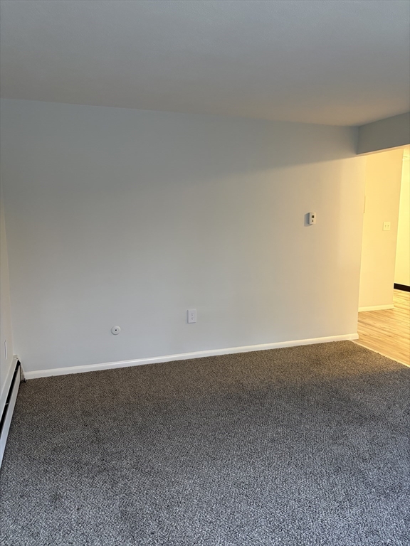 109 Trapelo Road, Unit 4 Waltham, MA 02452 - Photo 10 of 13 a view of an empty room