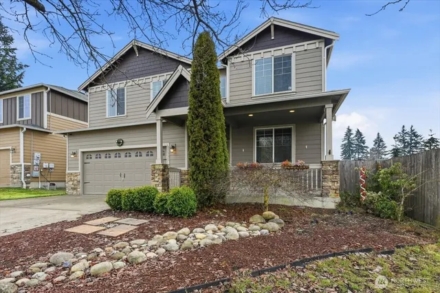 a front view of a house with garden