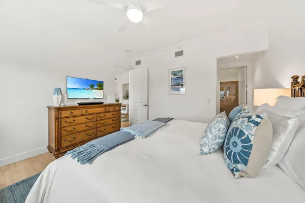 a bedroom with a bed and a dresser