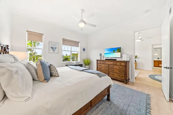 a bedroom with a bed and dresser