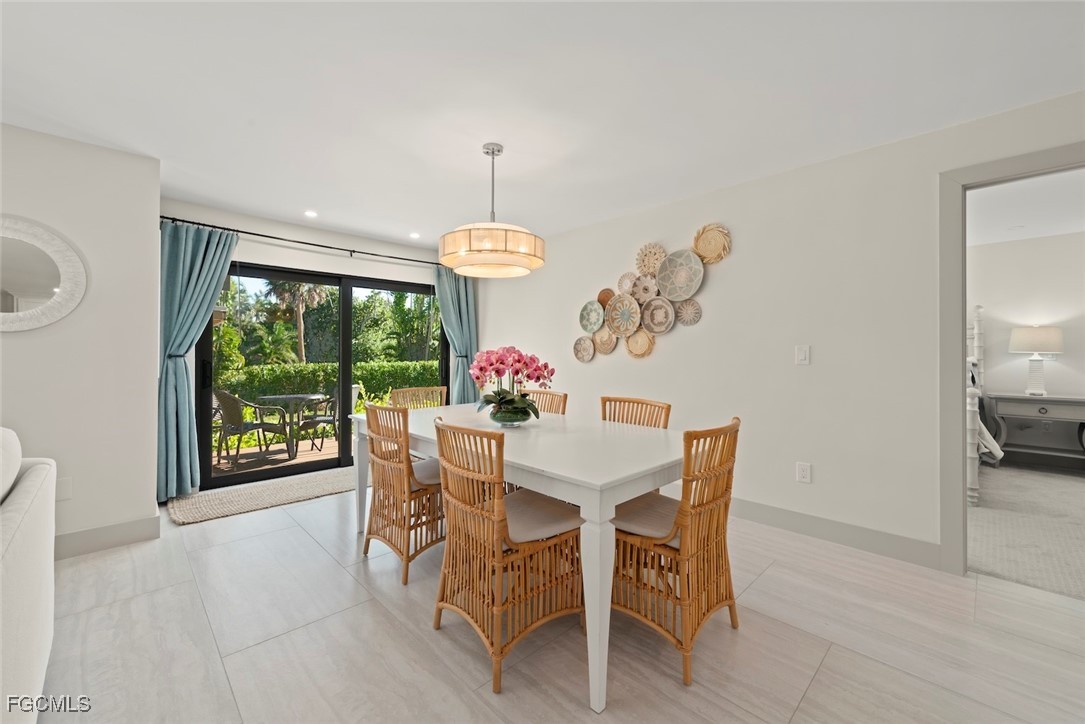 5117 Sea Bell Road, Unit G102 Sanibel, FL 33957 - Photo 11 of 49 a view of a dining room with furniture window and outside view
