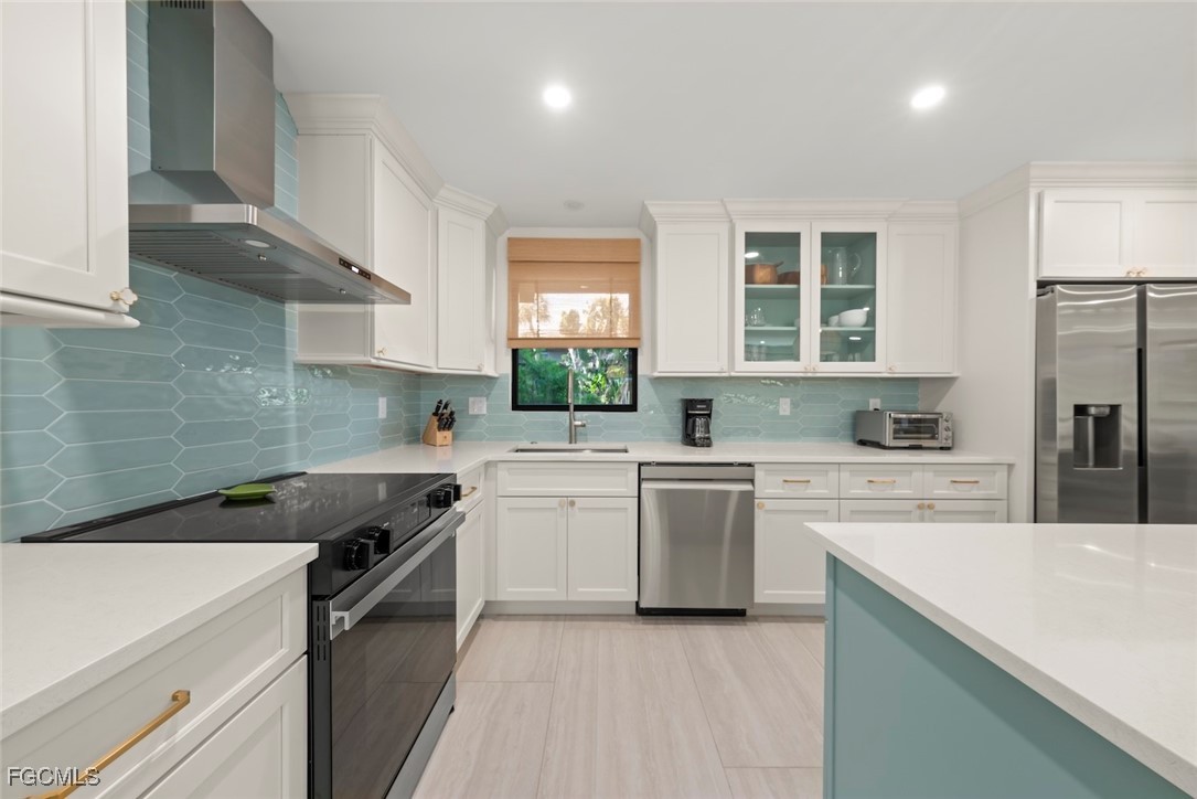 5117 Sea Bell Road, Unit G102 Sanibel, FL 33957 - Photo 16 of 49 a kitchen with a sink stove and refrigerator