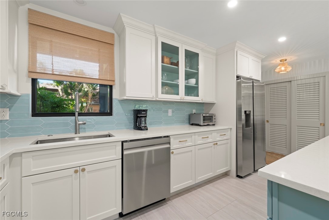 5117 Sea Bell Road, Unit G102 Sanibel, FL 33957 - Photo 17 of 49 a kitchen with a sink cabinets and window