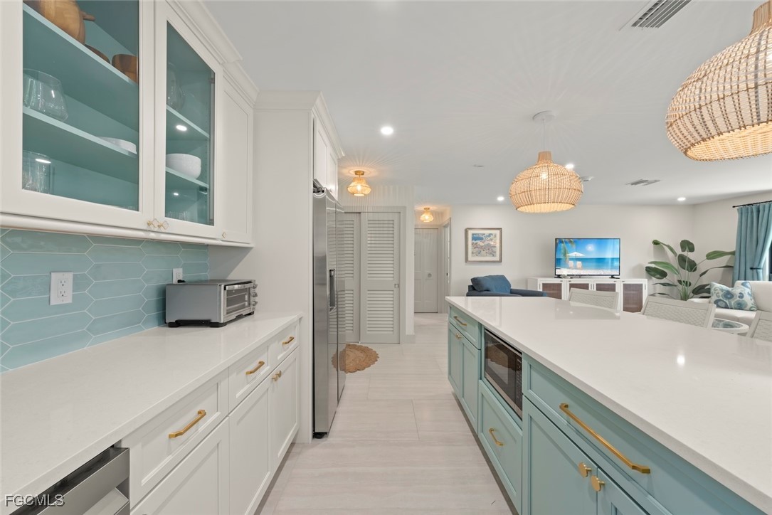 5117 Sea Bell Road, Unit G102 Sanibel, FL 33957 - Photo 19 of 49 a kitchen with a sink and a refrigerator