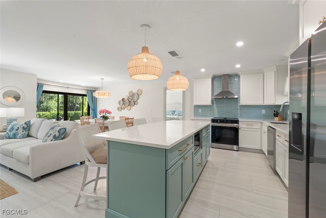 5117 Sea Bell Road, Unit G102 Sanibel, FL 33957 - Photo 20 of 49 a kitchen with kitchen island granite countertop a sink and a stove top oven
