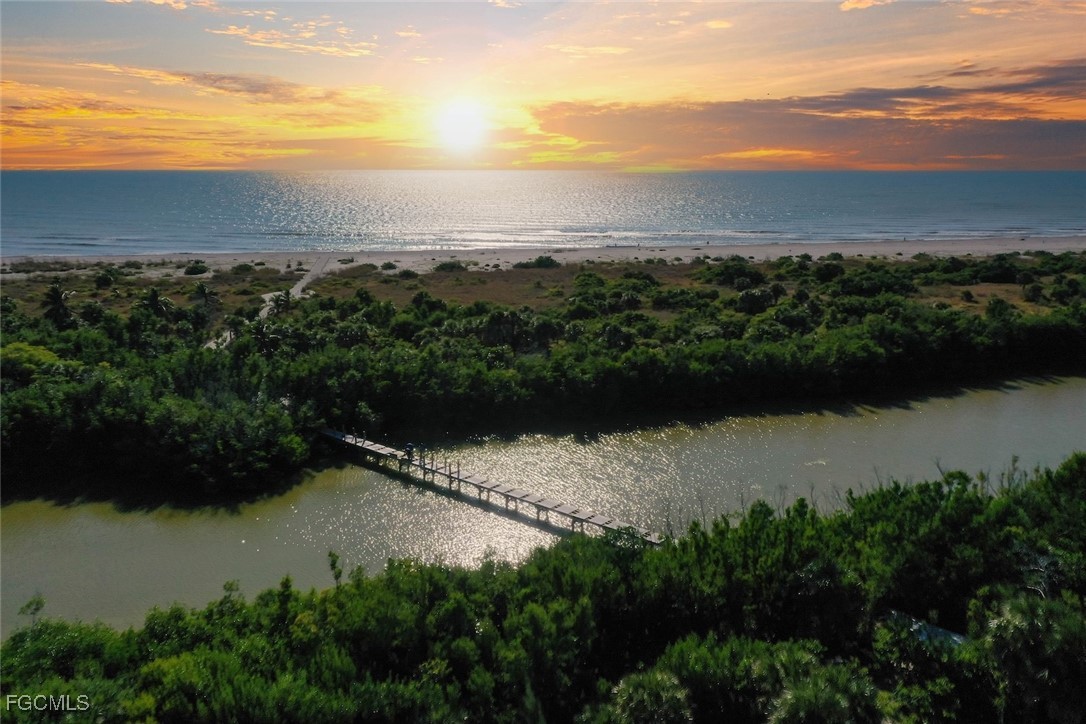 5117 Sea Bell Road, Unit G102 Sanibel, FL 33957 - Photo 2 of 49 a view of lake with mountain