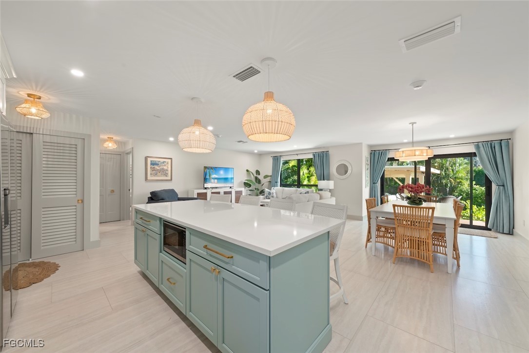 5117 Sea Bell Road, Unit G102 Sanibel, FL 33957 - Photo 21 of 49 a kitchen with a sink and a large window