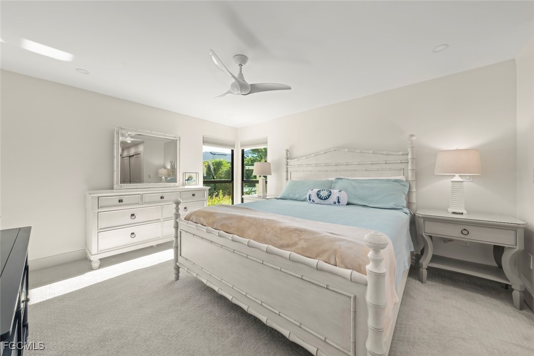 5117 Sea Bell Road, Unit G102 Sanibel, FL 33957 - Photo 22 of 49 a spacious bedroom with a bed and a large window