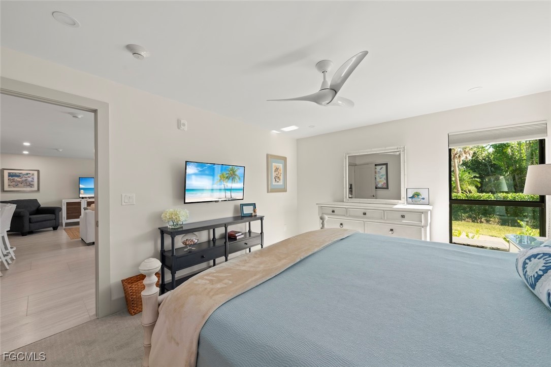 5117 Sea Bell Road, Unit G102 Sanibel, FL 33957 - Photo 24 of 49 a bedroom with a bed and a view of living room