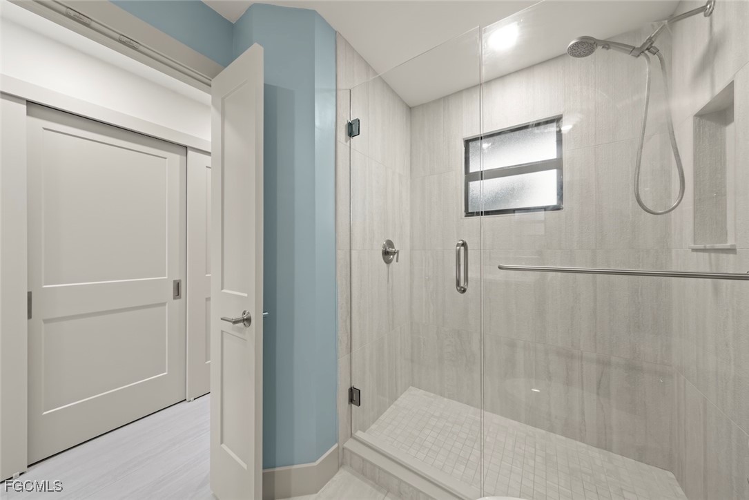 5117 Sea Bell Road, Unit G102 Sanibel, FL 33957 - Photo 26 of 49 a bathroom with a granite countertop shower and a sink