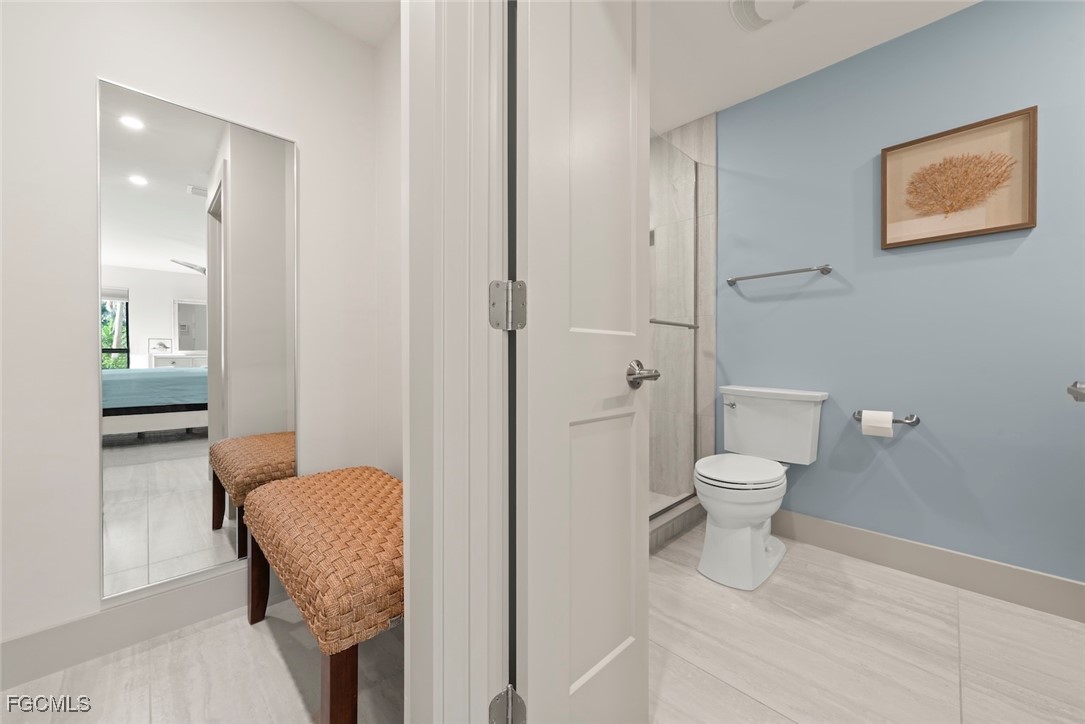 5117 Sea Bell Road, Unit G102 Sanibel, FL 33957 - Photo 29 of 49 a bathroom with a toilet and a shower