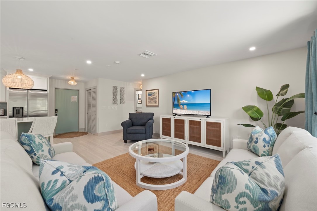 5117 Sea Bell Road, Unit G102 Sanibel, FL 33957 - Photo 5 of 49 a living room with furniture and a table