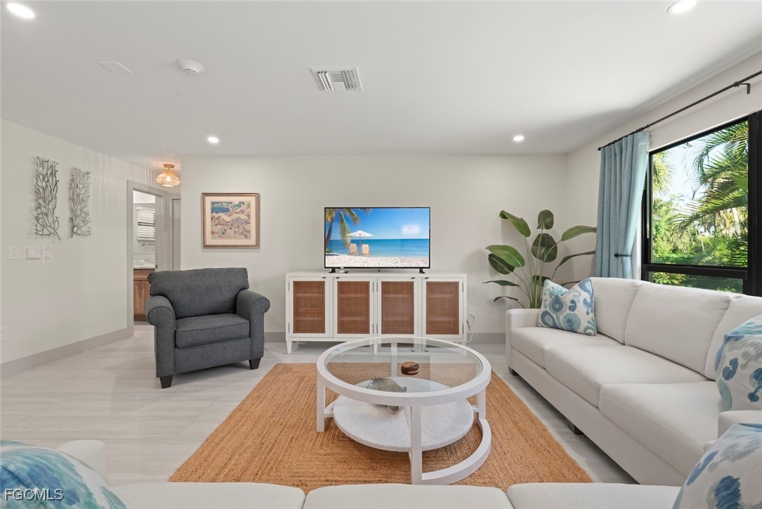 5117 Sea Bell Road, Unit G102 Sanibel, FL 33957 - Photo 7 of 49 a living room with furniture and a large window