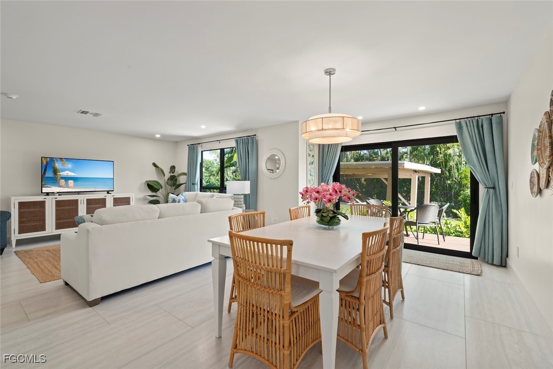 5117 Sea Bell Road, Unit G102 Sanibel, FL 33957 - Photo 10 of 49 a view of a dining room with furniture window and outside view