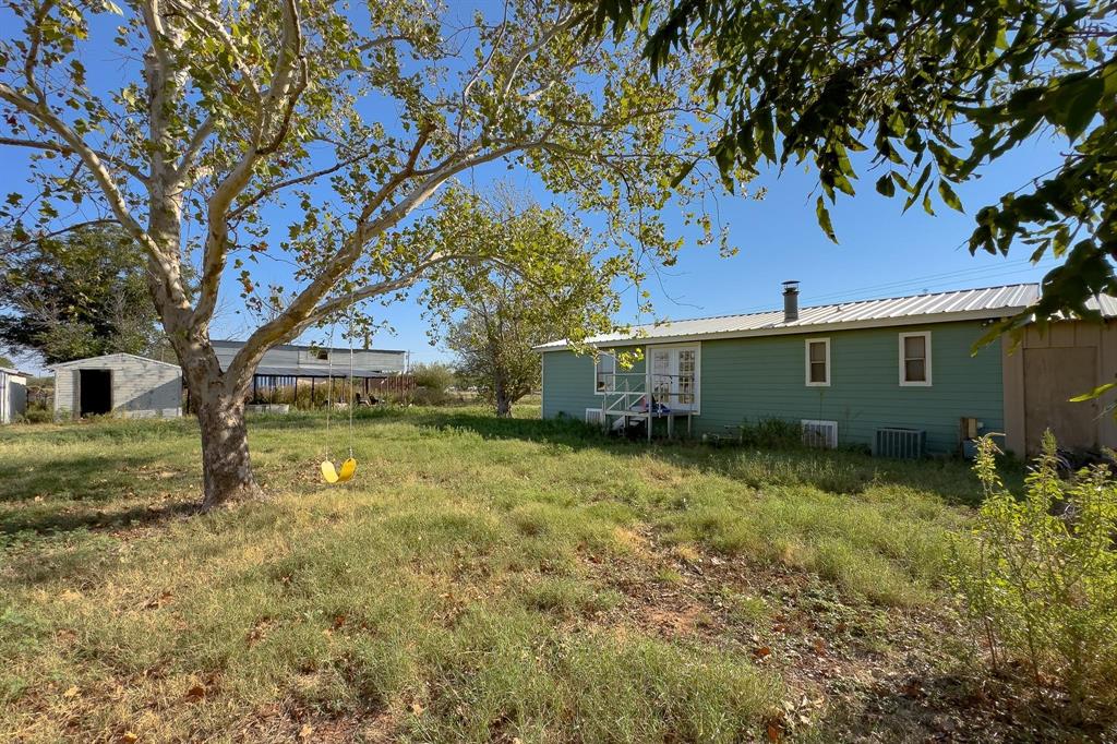 414 Bird Road Merkel, TX 79536 - Photo 8 of 19 a view of backyard of house with green space
