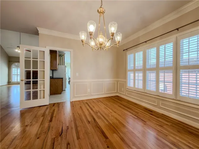 a kitchen with granite countertop cabinets stainless steel appliances and a sink