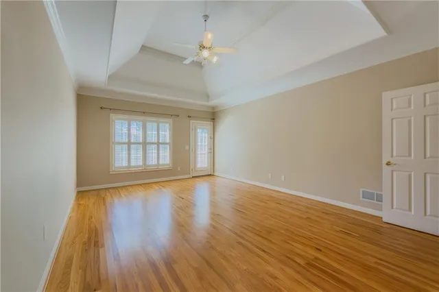 a spacious bathroom with a double vanity sink a mirror and a shower