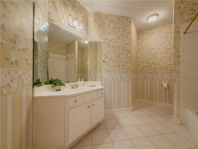 a bathroom with a double vanity sink and mirror