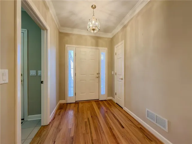 a view of an entryway with wooden floor