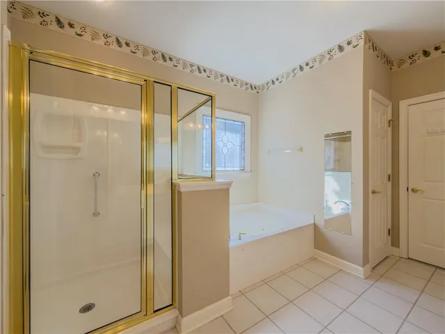 a bathroom with a double vanity sink and mirror