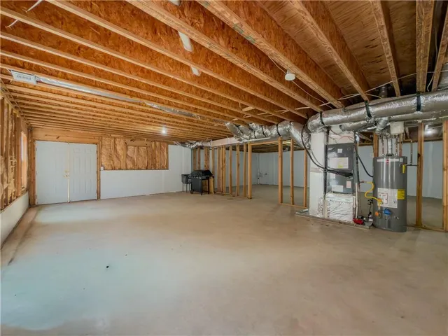 a view of backyard with wooden fence and trees