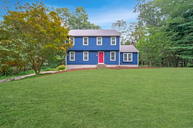 a view of a building with a yard
