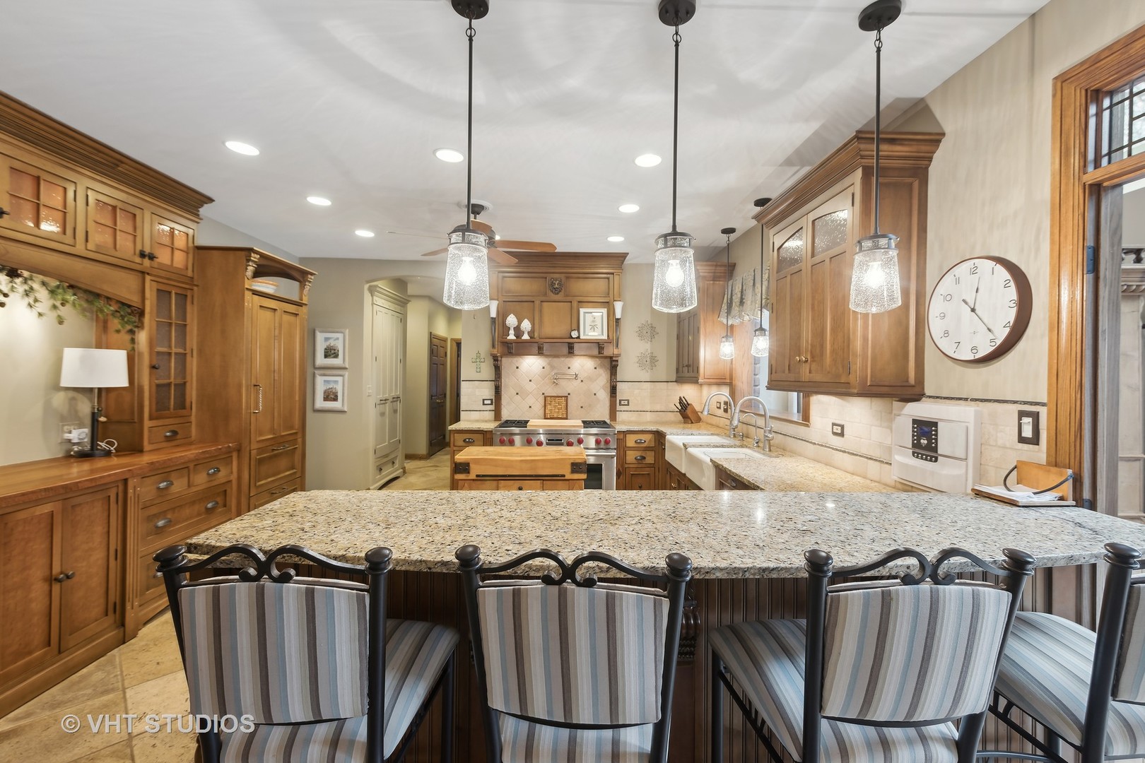 148 Circle Ridge Drive Burr Ridge, IL 60527 - Photo 6 of 71 a large kitchen with a table and chairs