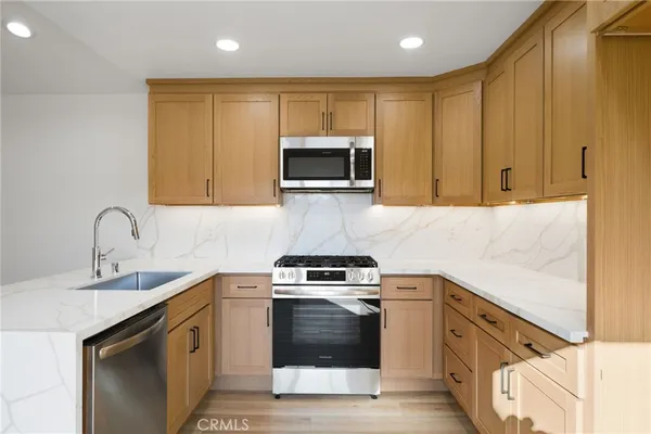 a kitchen with a stove and a microwave