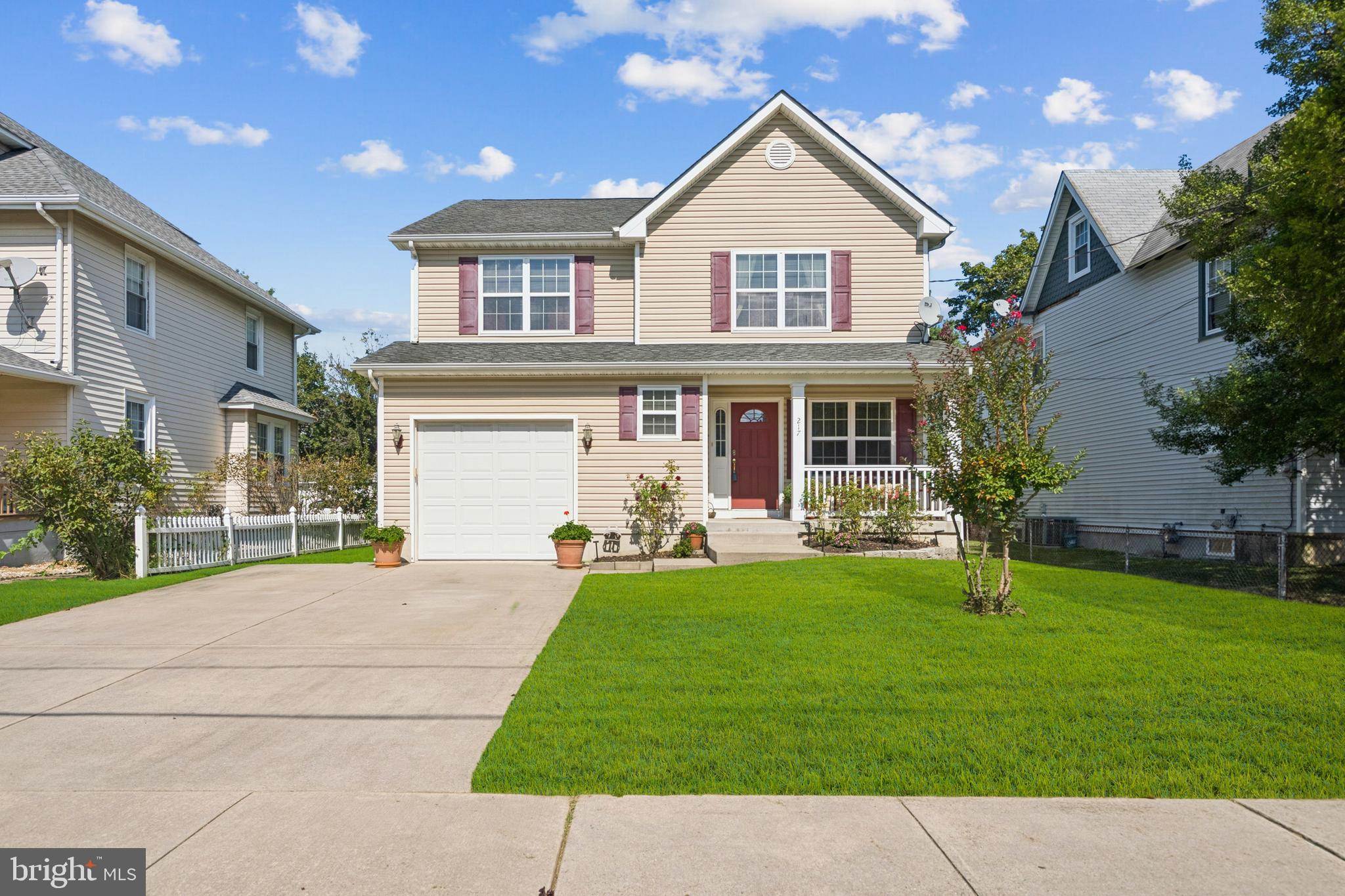 a view of a house with a yard and sitting area