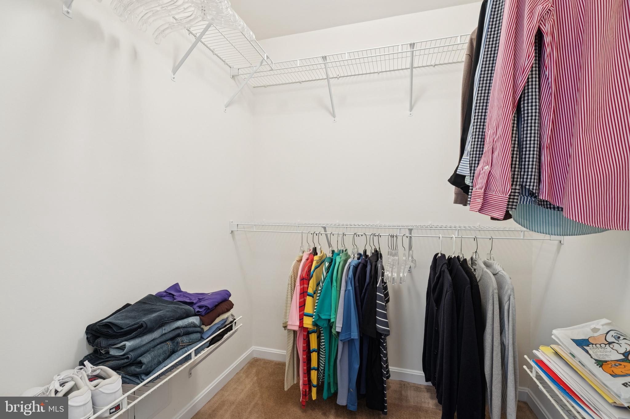 217 Cleveland Avenue Riverside, NJ 08075 - Photo 15 of 25 a view of walk in closet with clothes and shoes