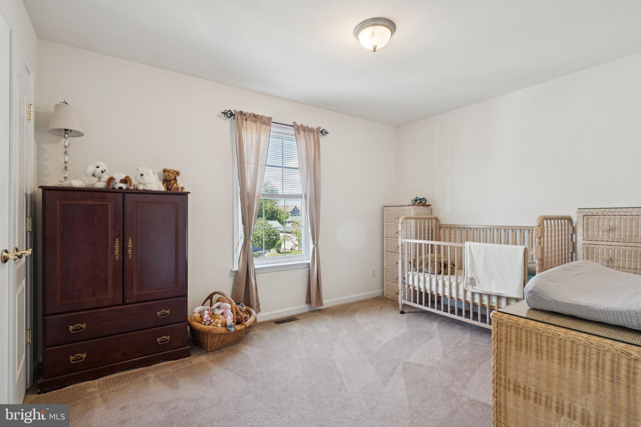 217 Cleveland Avenue Riverside, NJ 08075 - Photo 17 of 25 a view of a livingroom with a baby crib