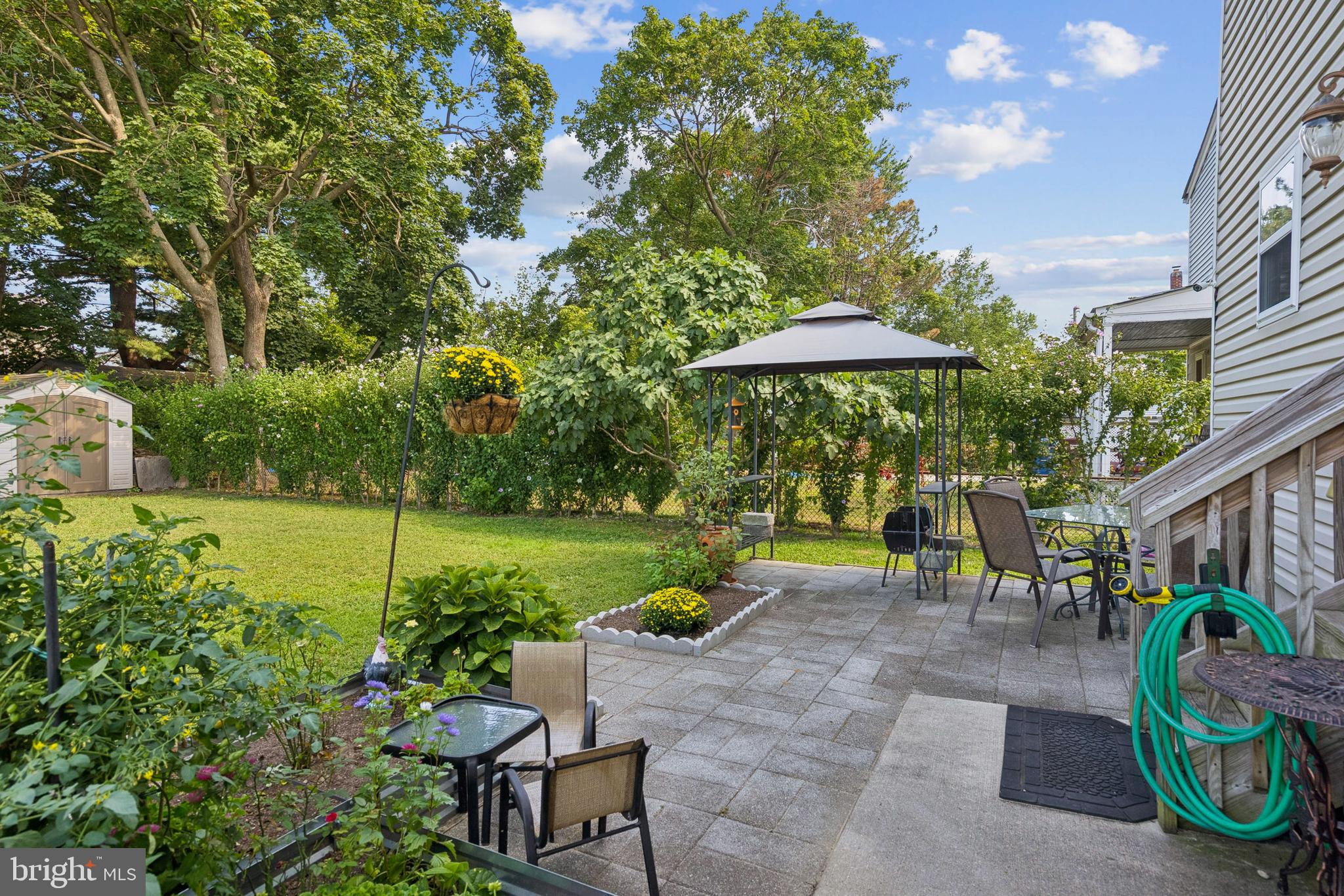 217 Cleveland Avenue Riverside, NJ 08075 - Photo 23 of 25 a view of a patio with furniture and a garden