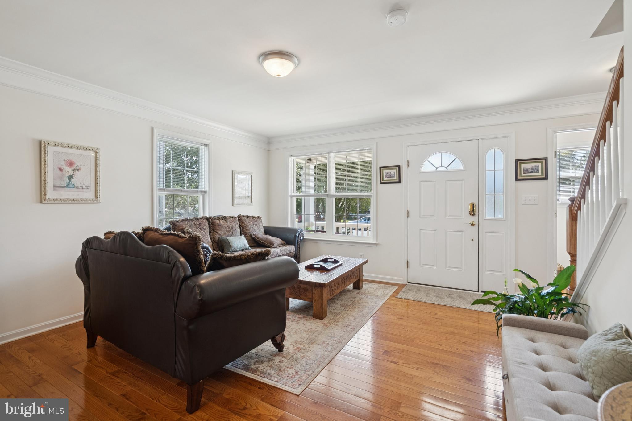 217 Cleveland Avenue Riverside, NJ 08075 - Photo 3 of 25 a living room with furniture and wooden floor