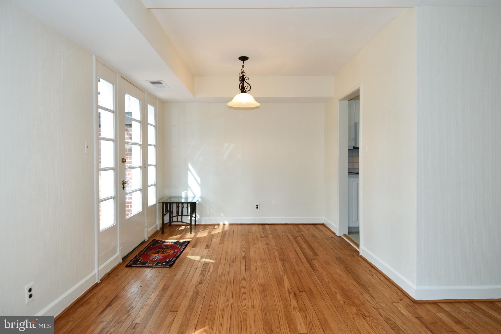 8520 Geren Road, Unit 183 Silver Spring, MD 20901 - Photo 11 of 34 a view of empty room with wooden floor and fan