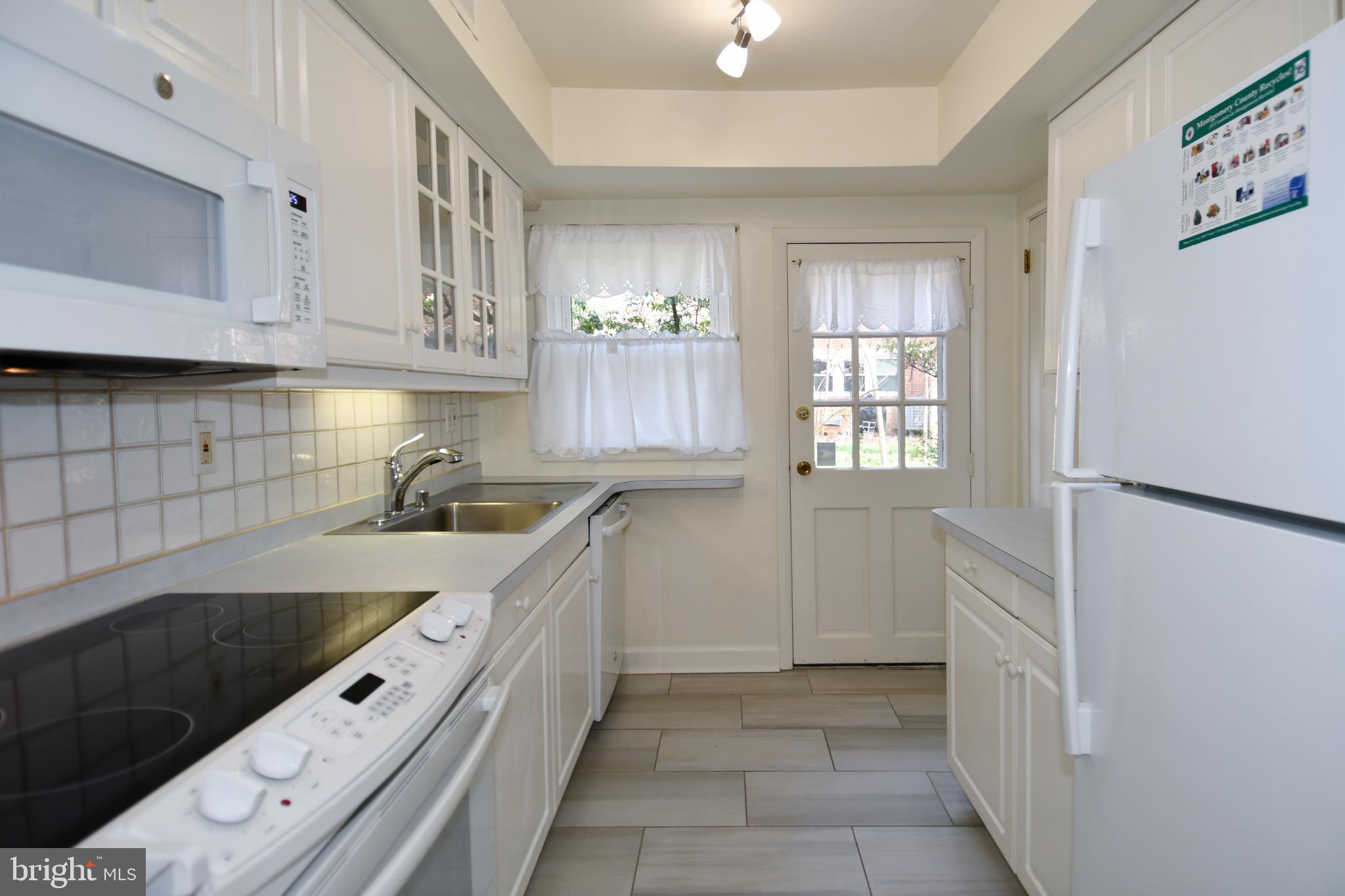 8520 Geren Road, Unit 183 Silver Spring, MD 20901 - Photo 17 of 34 a kitchen with a sink and cabinets