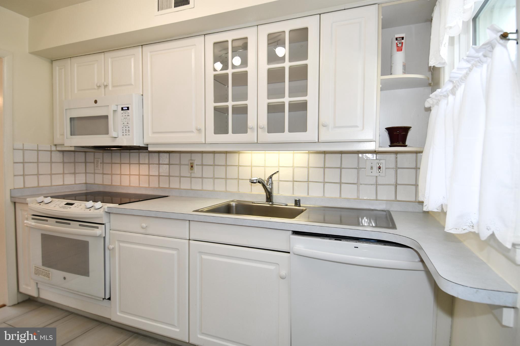8520 Geren Road, Unit 183 Silver Spring, MD 20901 - Photo 19 of 34 a view of a kitchen with sink and washer