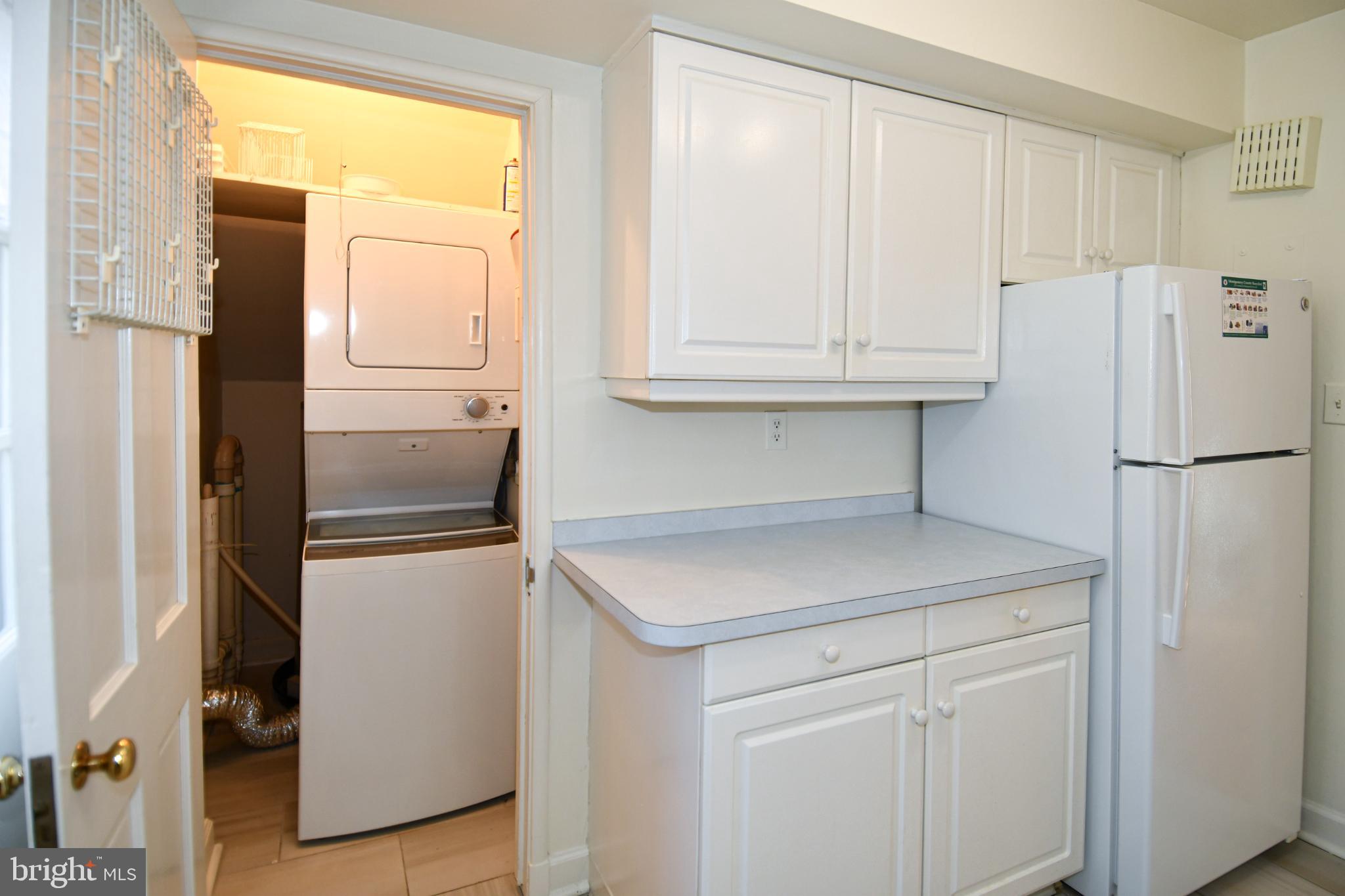 8520 Geren Road, Unit 183 Silver Spring, MD 20901 - Photo 22 of 34 a kitchen with refrigerator and window