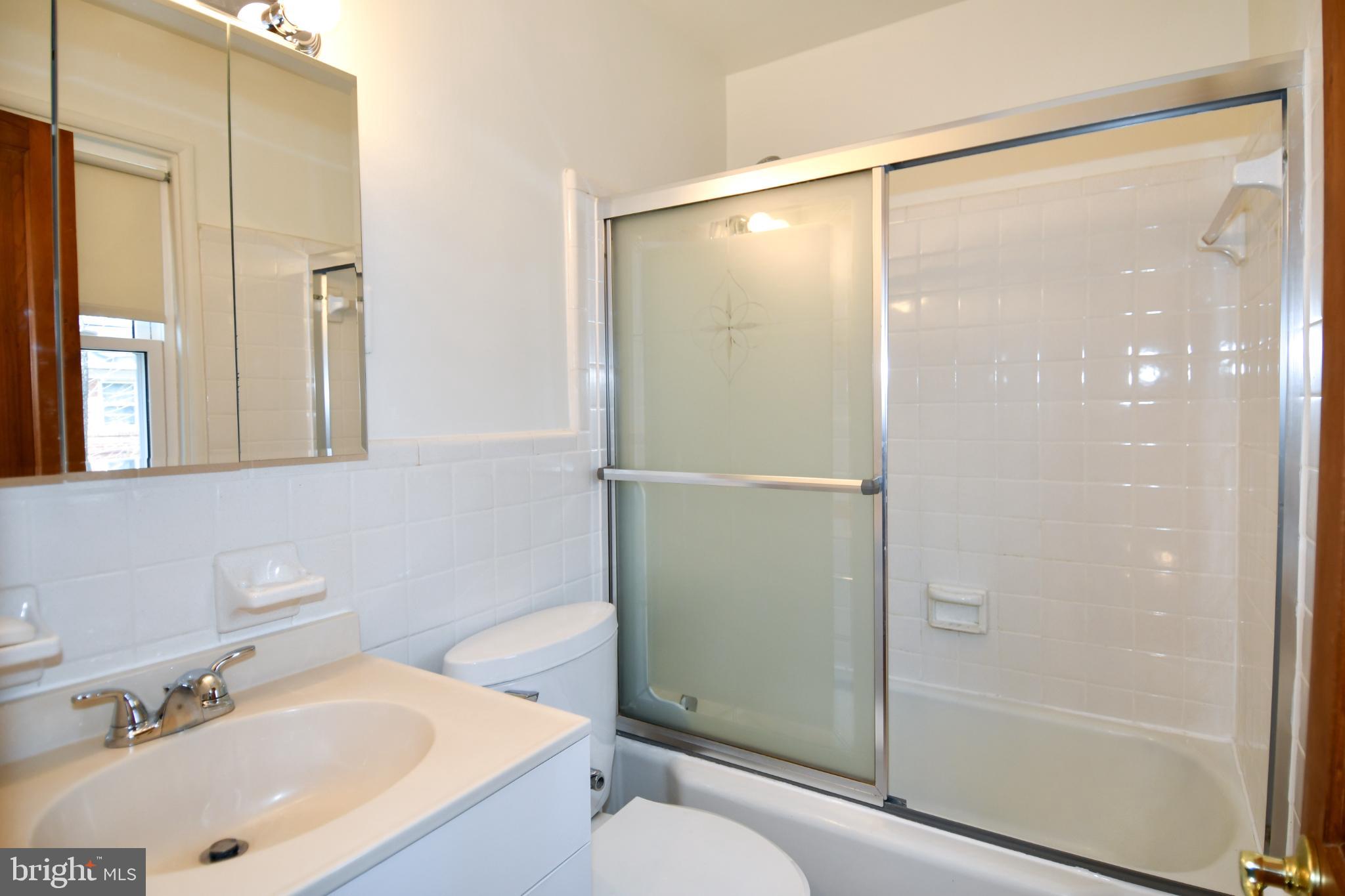 8520 Geren Road, Unit 183 Silver Spring, MD 20901 - Photo 23 of 34 a bathroom with a sink toilet and shower