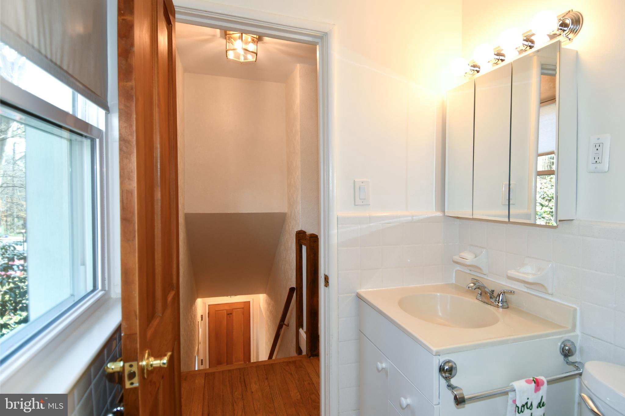 8520 Geren Road, Unit 183 Silver Spring, MD 20901 - Photo 24 of 34 a bathroom with a sink and a mirror