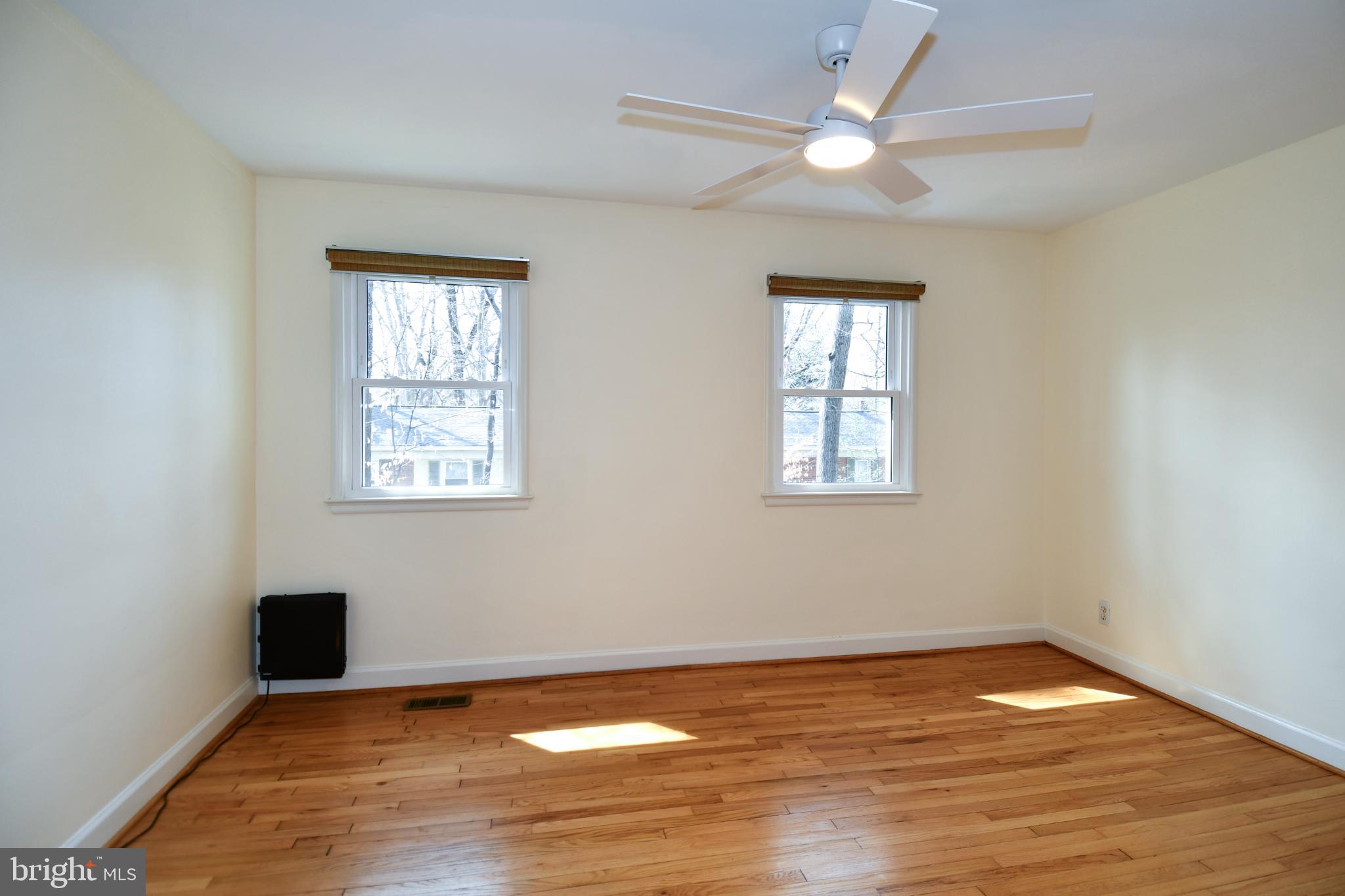 8520 Geren Road, Unit 183 Silver Spring, MD 20901 - Photo 25 of 34 wooden floor in an empty room with a window