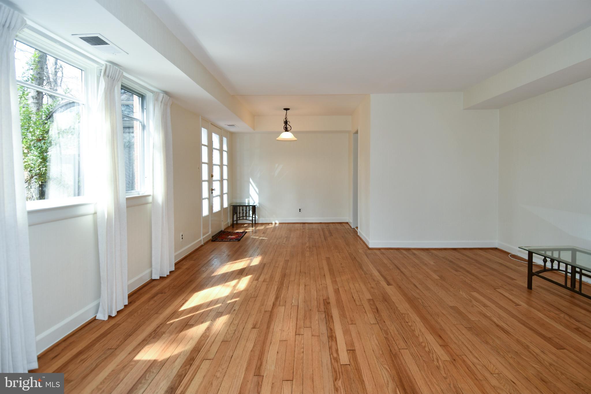 8520 Geren Road, Unit 183 Silver Spring, MD 20901 - Photo 6 of 34 a view of a room with wooden floor and balcony