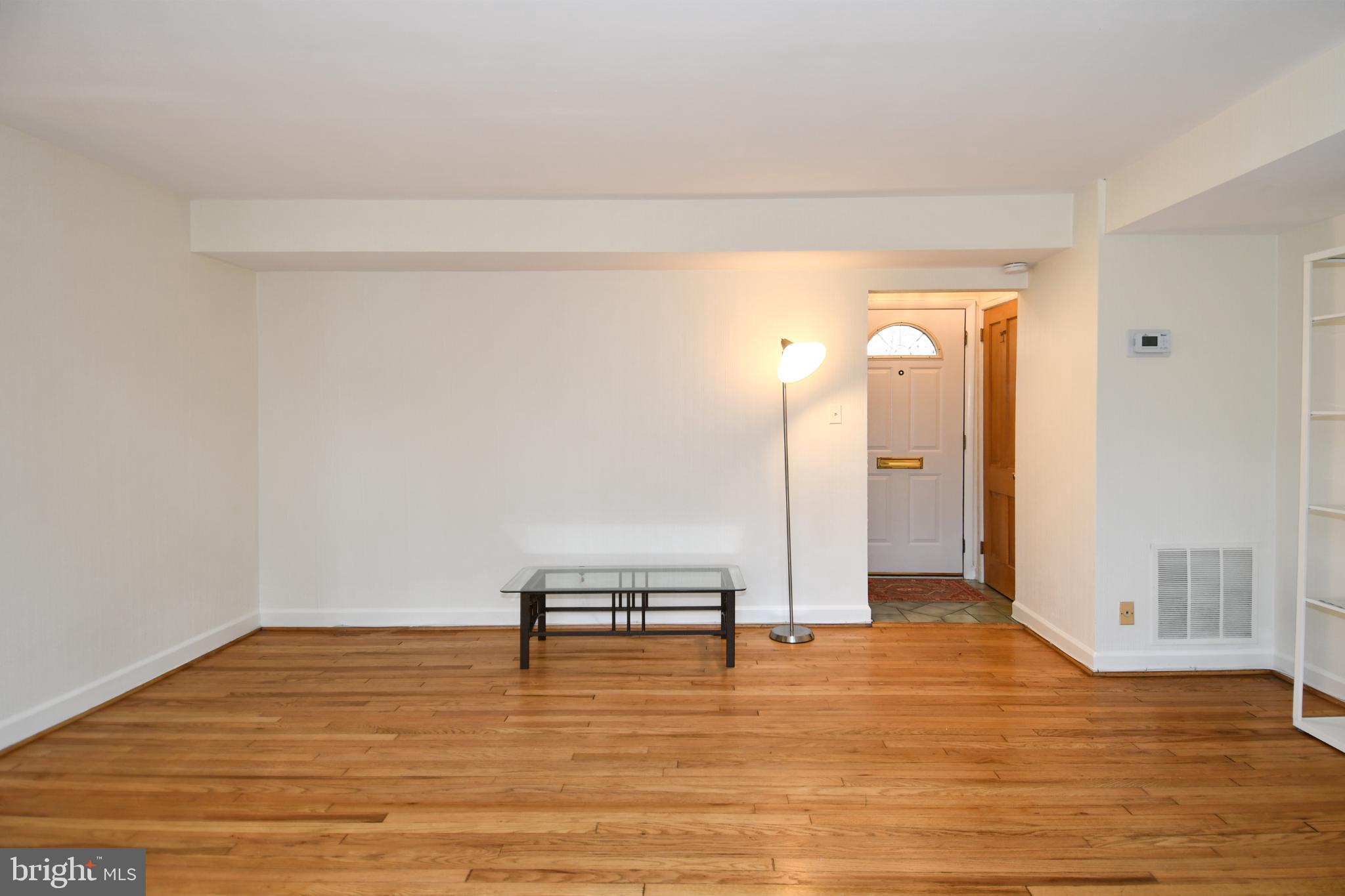 8520 Geren Road, Unit 183 Silver Spring, MD 20901 - Photo 10 of 34 a view of a room with wooden floor