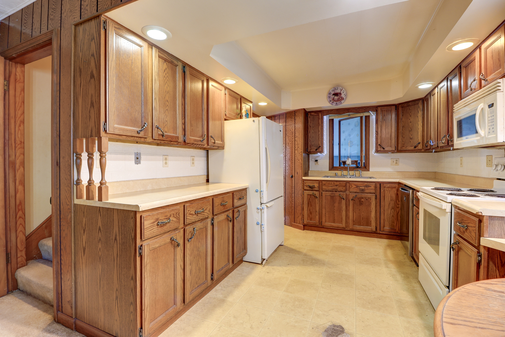 24839 Indian Ridge Road Sterling, IL 61081 - Photo 12 of 33 a kitchen with stainless steel appliances a refrigerator sink and cabinets
