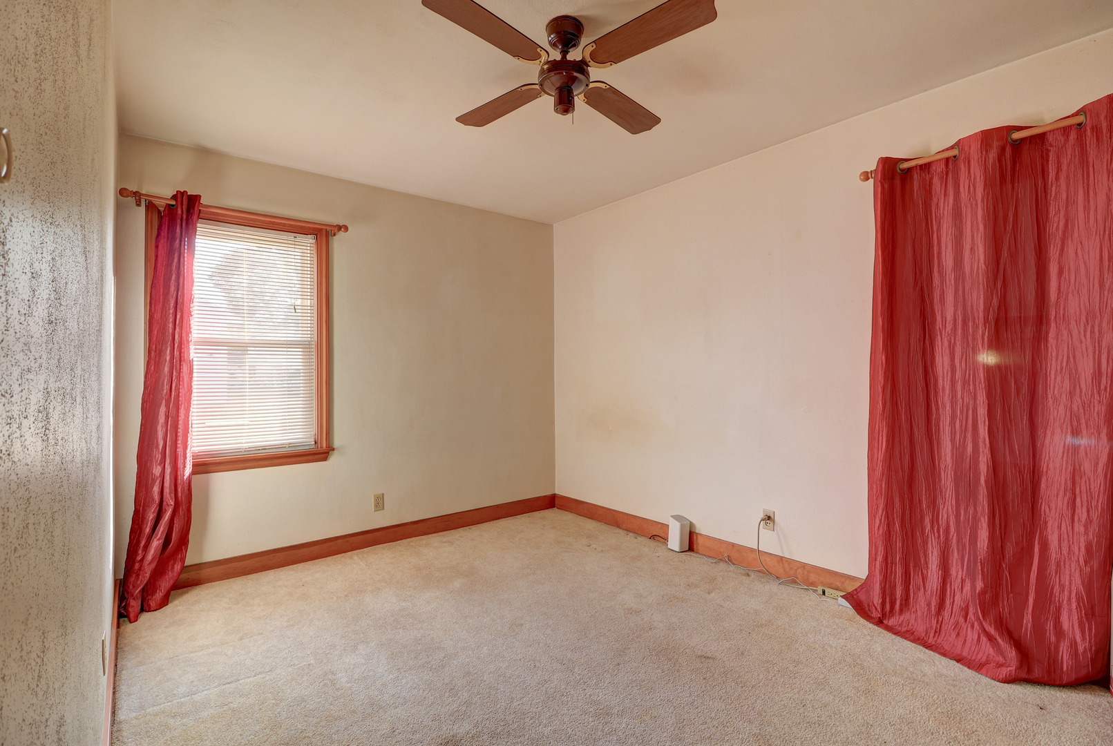 24839 Indian Ridge Road Sterling, IL 61081 - Photo 17 of 33 a view of a livingroom with a ceiling fan and window