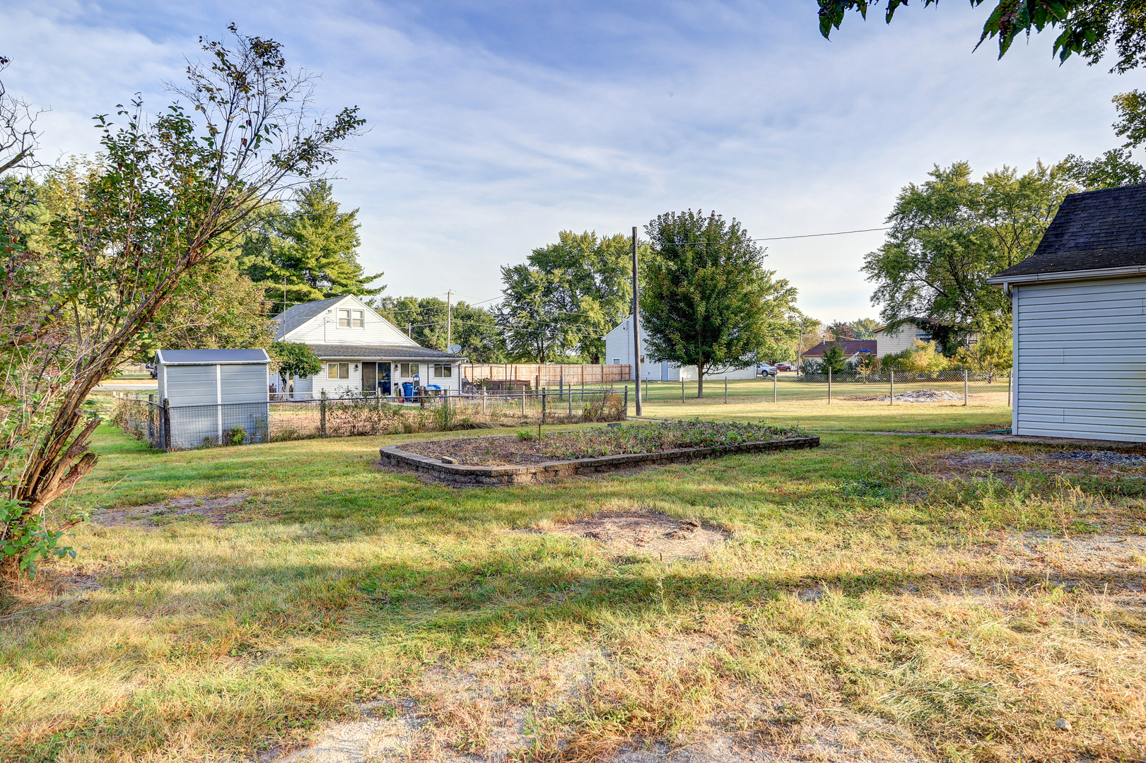 24839 Indian Ridge Road Sterling, IL 61081 - Photo 30 of 33 a view of swimming pool with lawn chairs and plants