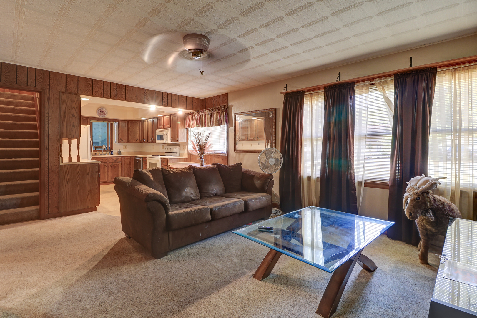 24839 Indian Ridge Road Sterling, IL 61081 - Photo 9 of 33 a living room with furniture and a chandelier